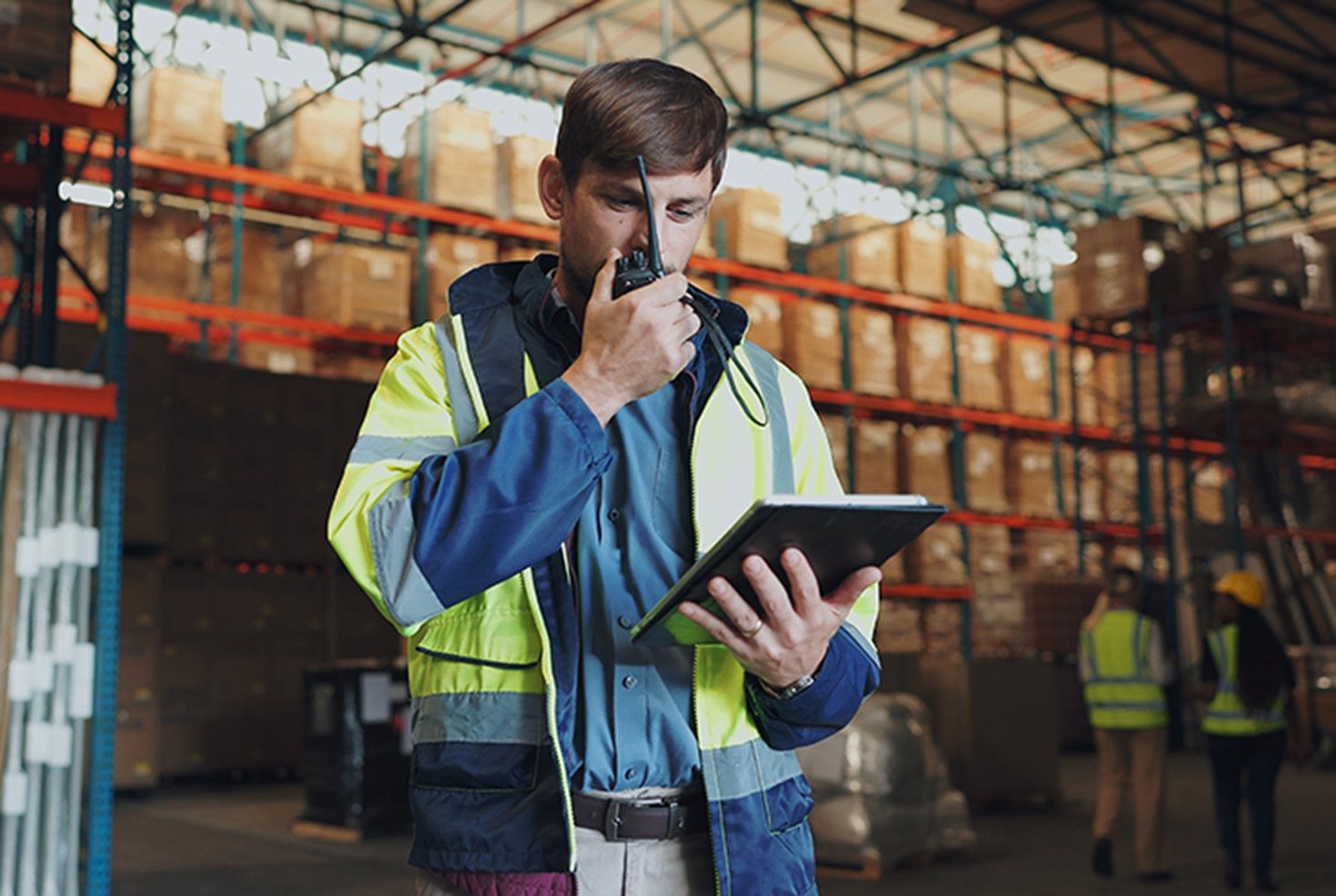 How do you connect two-way radios across multiple sites?