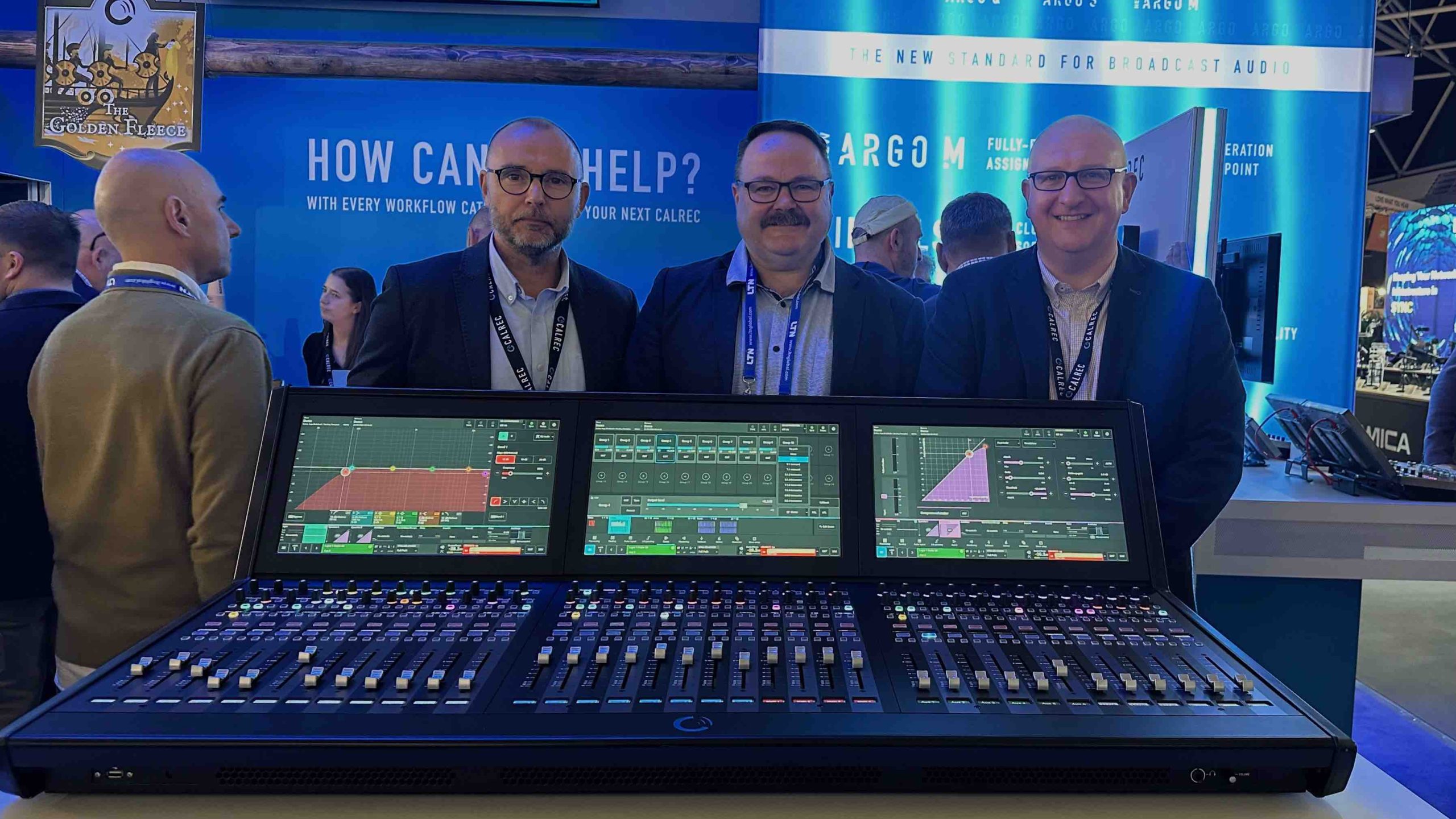 Calrec GM Sid Stanley, D2N MD Jason Owen and Calrec Global Sales Director David Letson at IBC 2024 with the new Argo M 36-fader